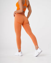 Sunset Orange Curve Seamless Leggings Sunset Orange | NVGTN Online Shop