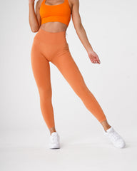 Sunset Orange Curve Seamless Leggings Sunset Orange | NVGTN Online Shop